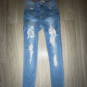 Distressed denim skinny jeans